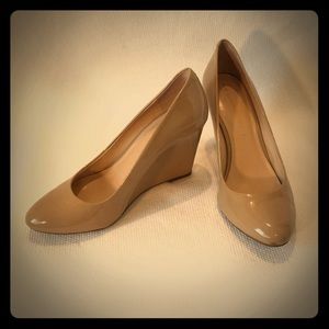 Nude wedge patent pumps